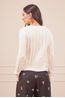 CALCA-PRETA-ESTAMPA-ARABESCO-COM-BLUSA-TRICOT-MANGA-LONGA-BRANCA-TRANCADA-5.jpg